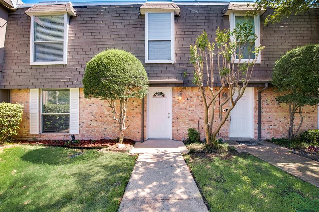 13340 Kit Lane, Unit B08 Dallas, TX 75240 - Photo 1 of 1 a front view of a house with garden