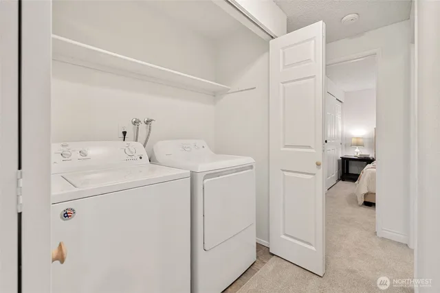 a bedroom with a bed and a lamp