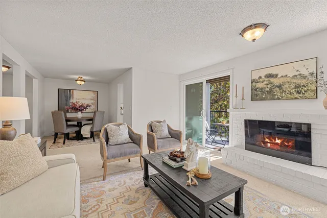 a living room with furniture a lamp and a window