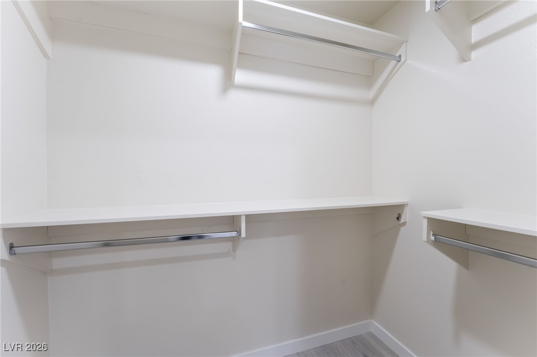 2200 South Fort Apache Road, Unit 1101 Las Vegas, NV 89117 - Photo 27 of 42 Walk in closet with light wood-style floors