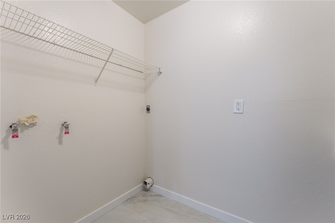 2200 South Fort Apache Road, Unit 1101 Las Vegas, NV 89117 - Photo 31 of 42 Laundry room featuring light marble finish flooring and hookup for an electric dryer