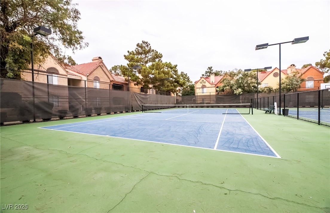 2200 South Fort Apache Road, Unit 1101 Las Vegas, NV 89117 - Photo 39 of 42 View of tennis court with community basketball court and a residential view