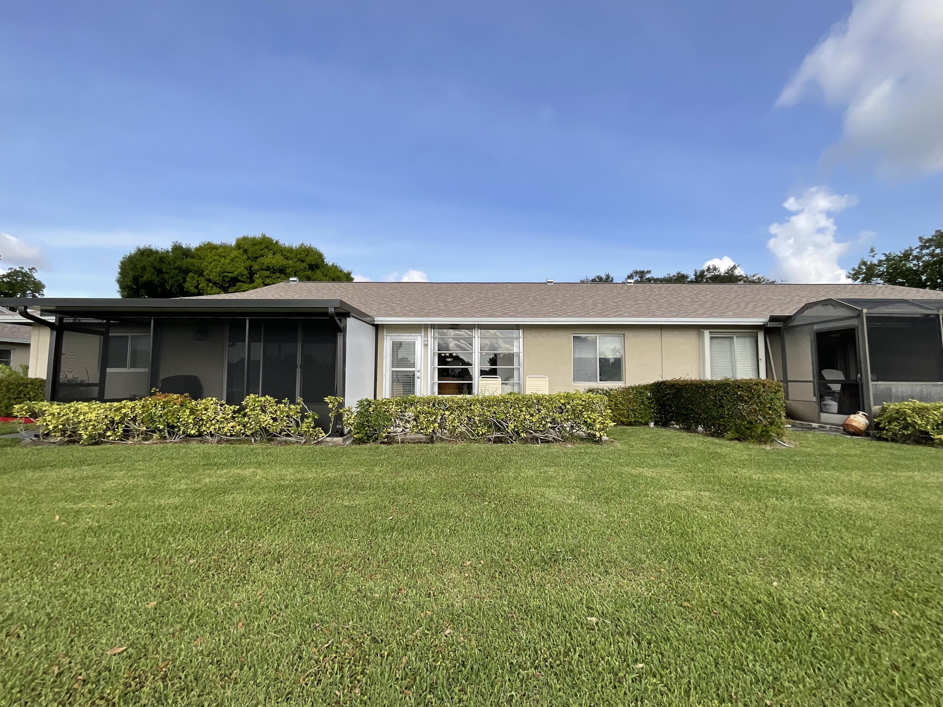18856 Argosy Drive, Unit C Boca Raton, FL 33496 - Photo 11 of 62 a front view of a house with a garden