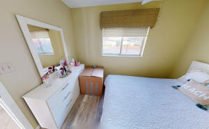 18856 Argosy Drive, Unit C Boca Raton, FL 33496 - Photo 20 of 62 a bedroom with a bed and wooden floor