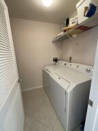 18856 Argosy Drive, Unit C Boca Raton, FL 33496 - Photo 26 of 62 a utility room with dryer and washer