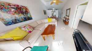 18856 Argosy Drive, Unit C Boca Raton, FL 33496 - Photo 40 of 62 a view of a living room with a couch and chandelier