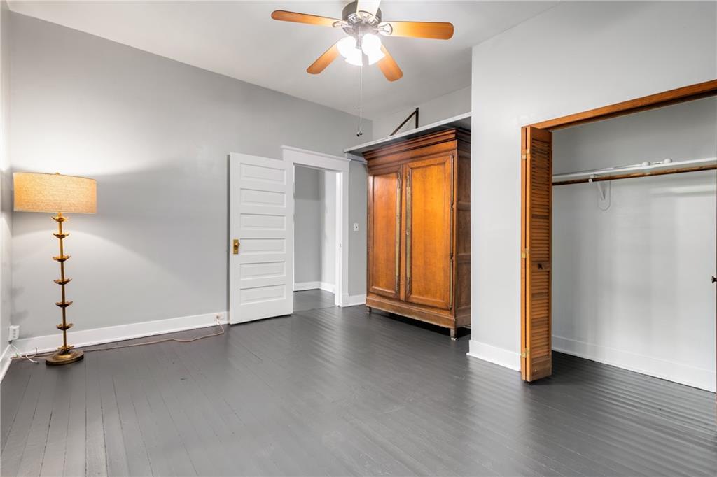 1323 La France Street Northeast, Unit 2 Atlanta, GA 30307 - Photo 11 of 25 an empty room with wooden floor closet and windows