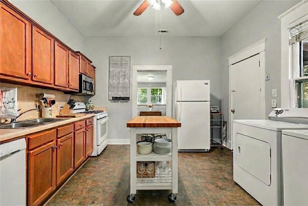 1323 La France Street Northeast, Unit 2 Atlanta, GA 30307 - Photo 17 of 25 a kitchen with refrigerator a stove and a sink