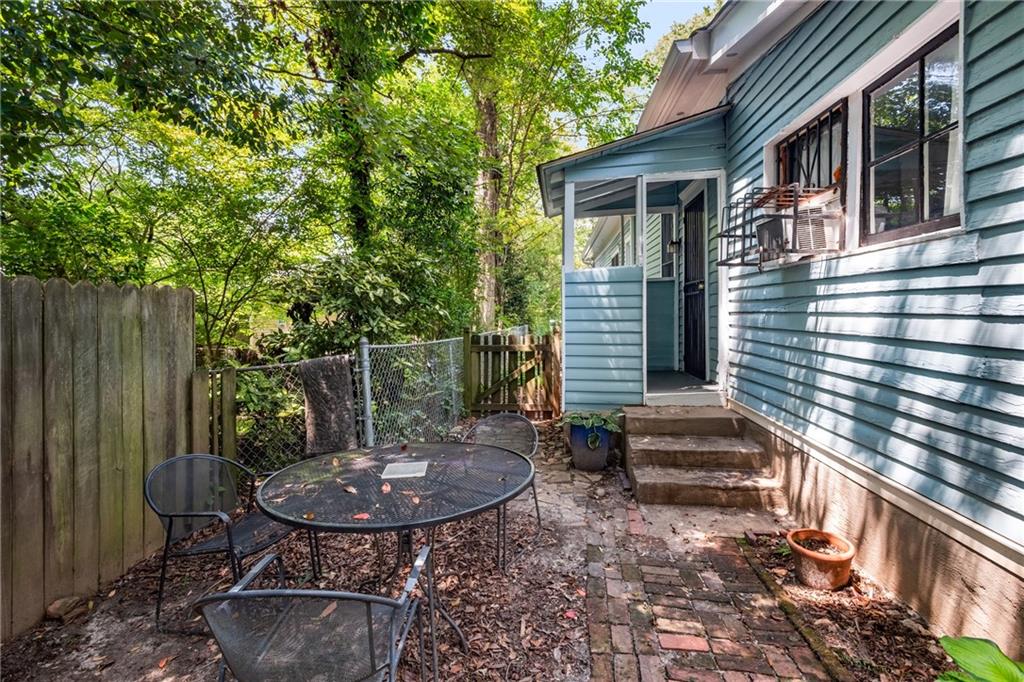 1323 La France Street Northeast, Unit 2 Atlanta, GA 30307 - Photo 23 of 25 a view of a chair and table in backyard