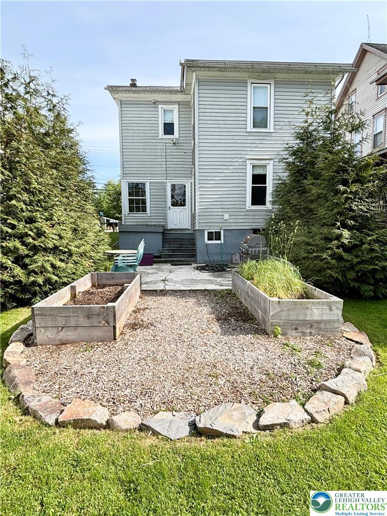 7241 Decatur Street New Tripoli, PA 18066 - Photo 29 of 36 A quaint backyard garden area awaits, complete with raised planting beds and a gravel patio space.