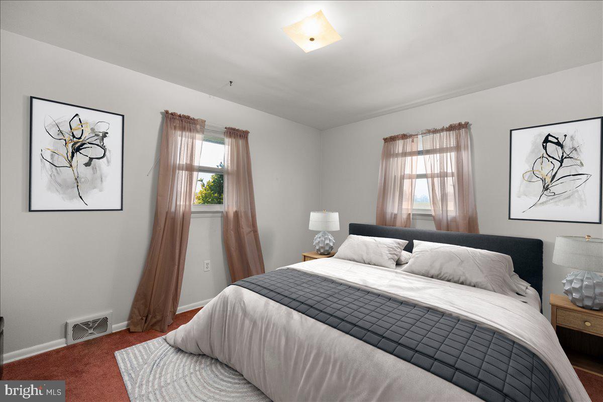 2447 Rittenour Road Edinburg, VA 22824 - Photo 15 of 40 a bedroom with a large bed and a window