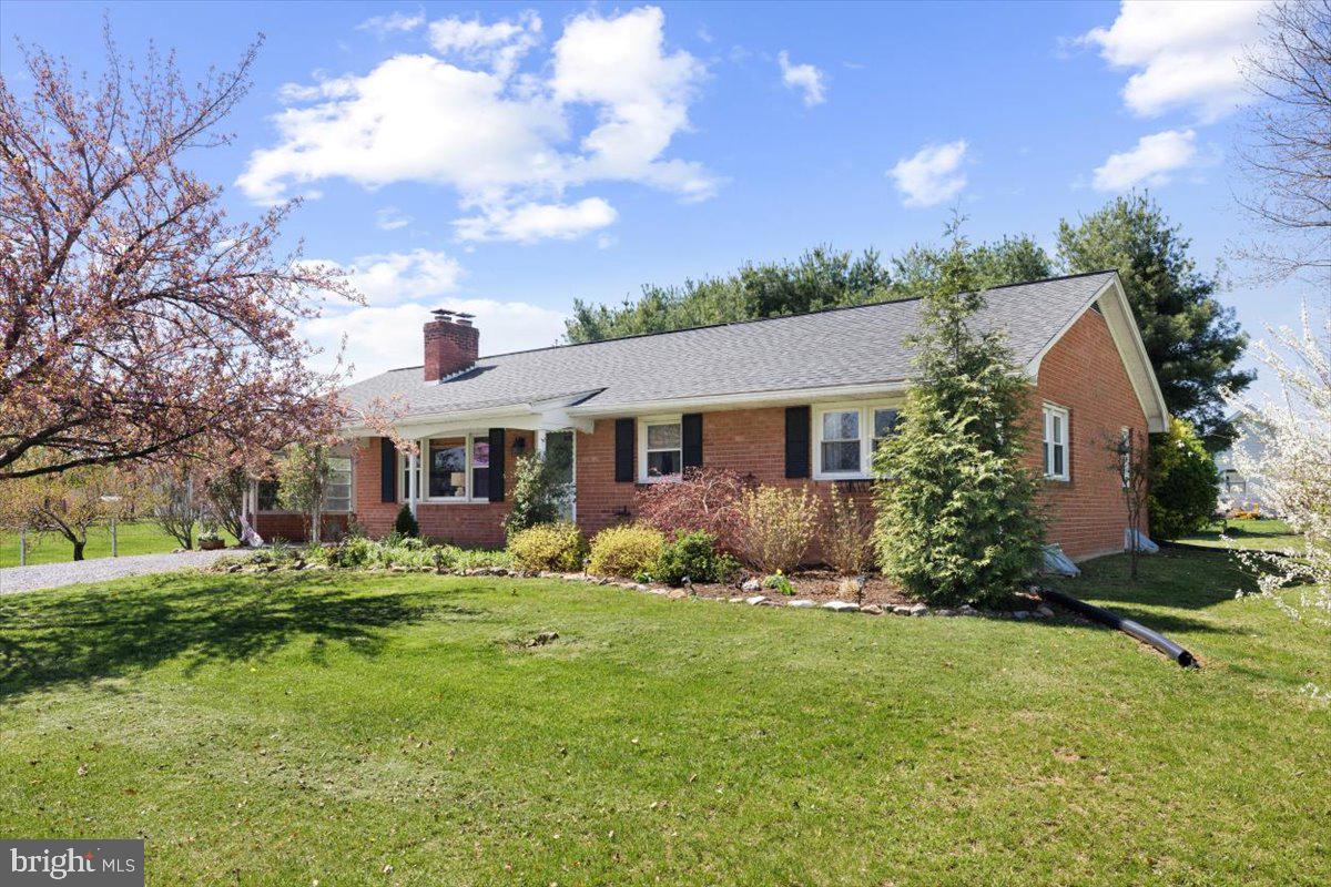 2447 Rittenour Road Edinburg, VA 22824 - Photo 3 of 40 a front view of house with yard and green space
