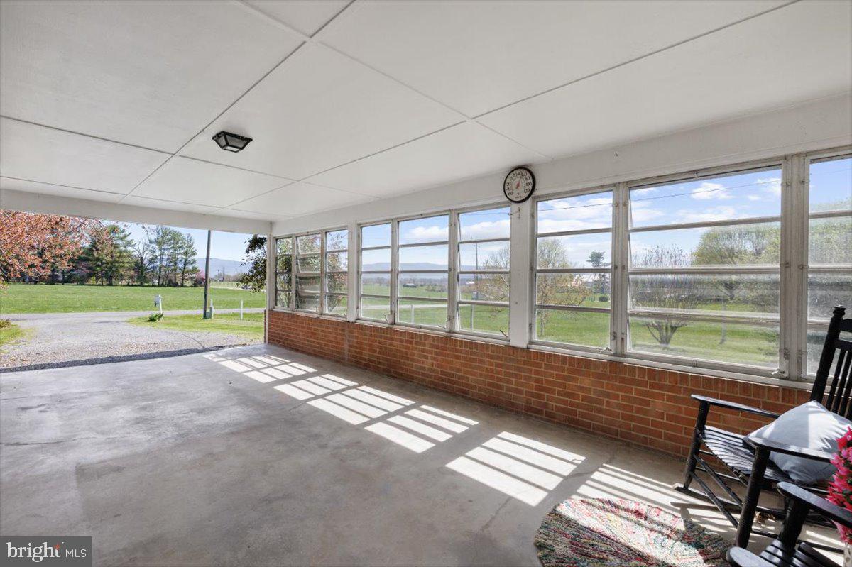 2447 Rittenour Road Edinburg, VA 22824 - Photo 31 of 40 a view of a room with wooden floor and windows