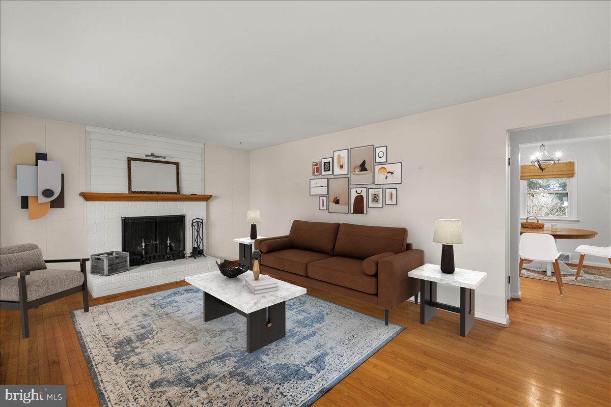2447 Rittenour Road Edinburg, VA 22824 - Photo 5 of 40 a living room with furniture and a fireplace
