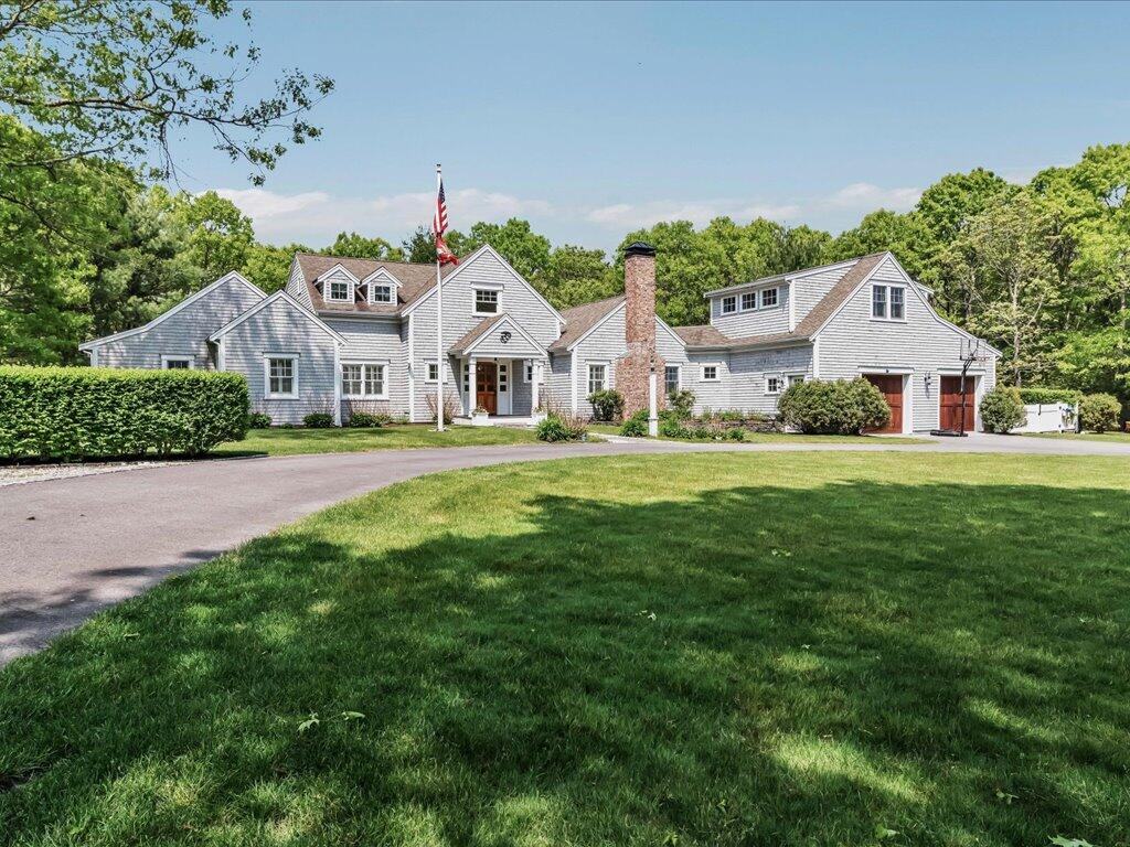 160 Cedar Tree Neck Road Marstons Mills, MA 02648 - Photo 1 of 44 a front view of a house with a yard