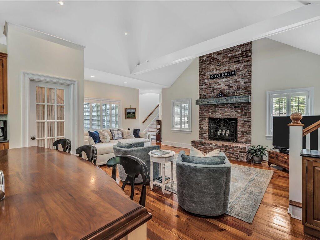 160 Cedar Tree Neck Road Marstons Mills, MA 02648 - Photo 11 of 44 a living room with furniture large window and a fireplace