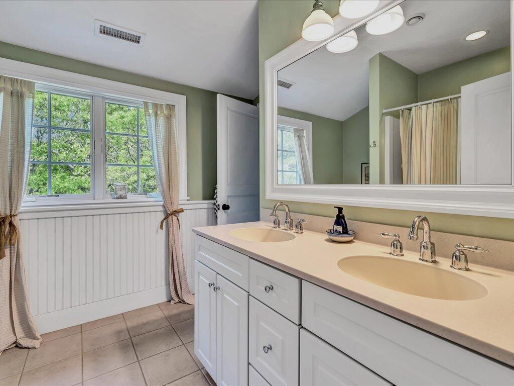 160 Cedar Tree Neck Road Marstons Mills, MA 02648 - Photo 27 of 44 a bathroom with a sink and a mirror