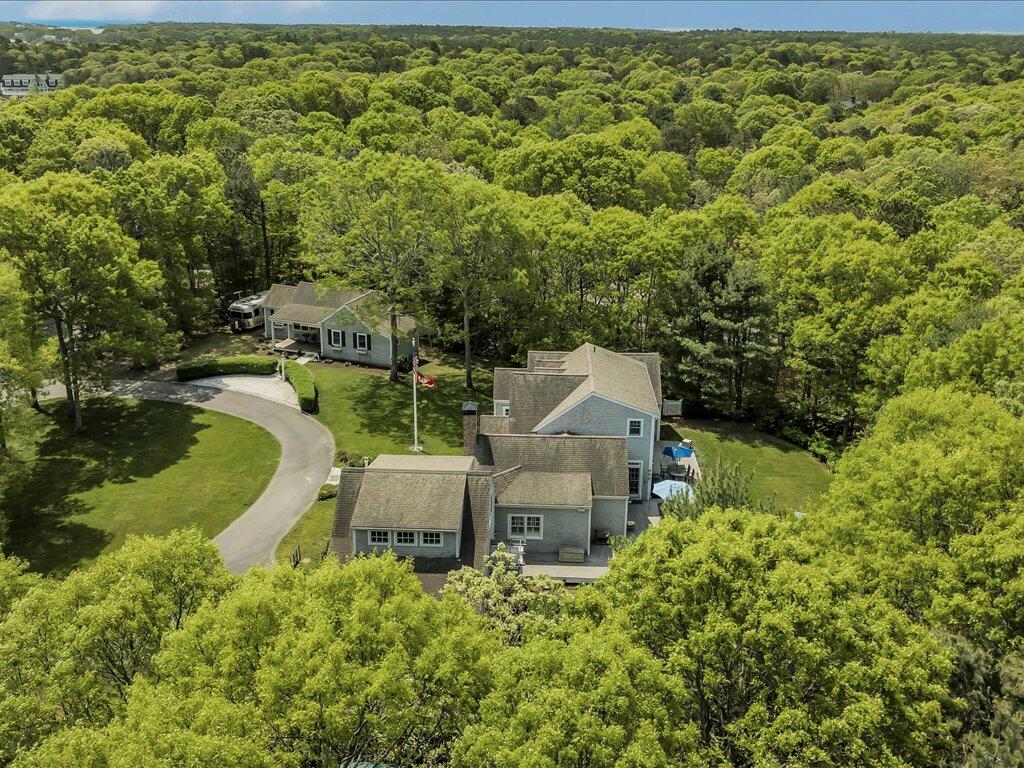 160 Cedar Tree Neck Road Marstons Mills, MA 02648 - Photo 38 of 44 an aerial view of a house with swimming pool outdoor seating and yard