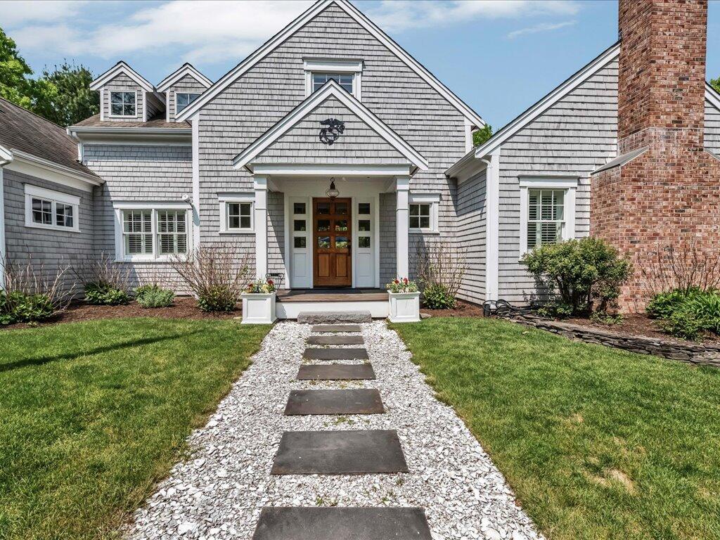 160 Cedar Tree Neck Road Marstons Mills, MA 02648 - Photo 4 of 44 front view of a house and a yard