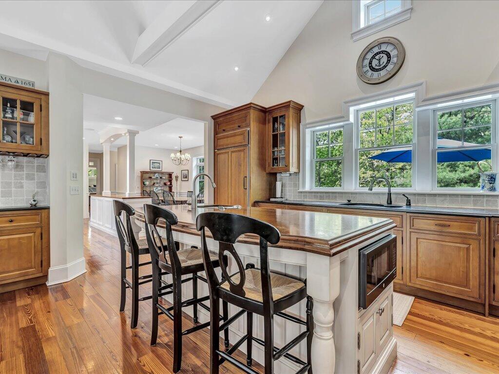 160 Cedar Tree Neck Road Marstons Mills, MA 02648 - Photo 8 of 44 a kitchen that has a table and chairs in it