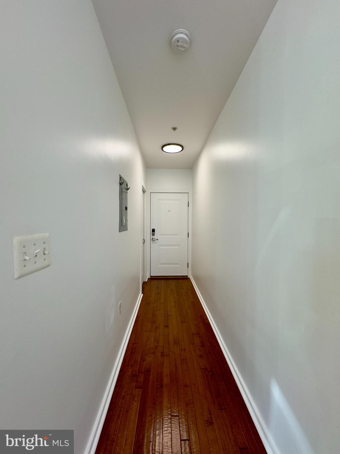 613 Portland Street, Unit 5 Baltimore, MD 21230 - Photo 2 of 7 a view of a hallway with wooden floor