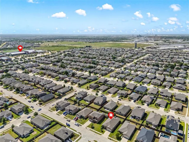 an aerial view of a house with a garden