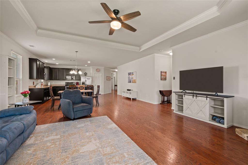 537 Running Water Trail Fort Worth, TX 76131 - Photo 8 of 31 a living room with furniture and a flat screen tv