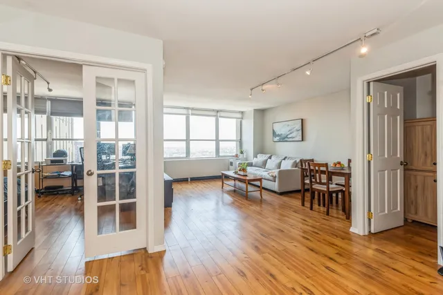 a view of kitchen with furniture and wooden floor