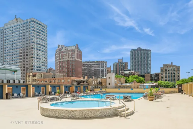 a view of a city with tall buildings and a big yard