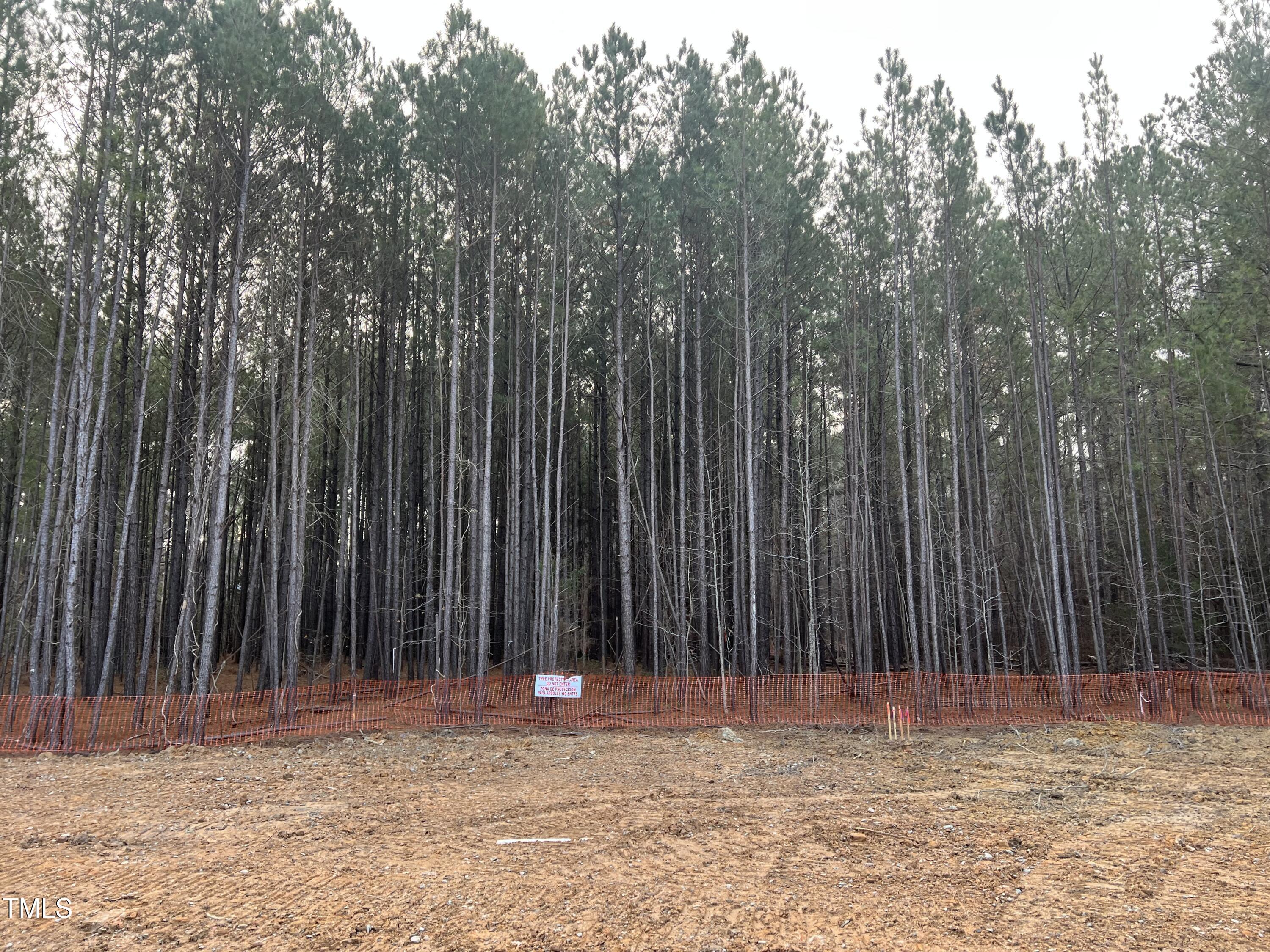39 Anfield Road New Hill, NC 27562 - Photo 7 of 12 a view of outdoor space with wooden fence