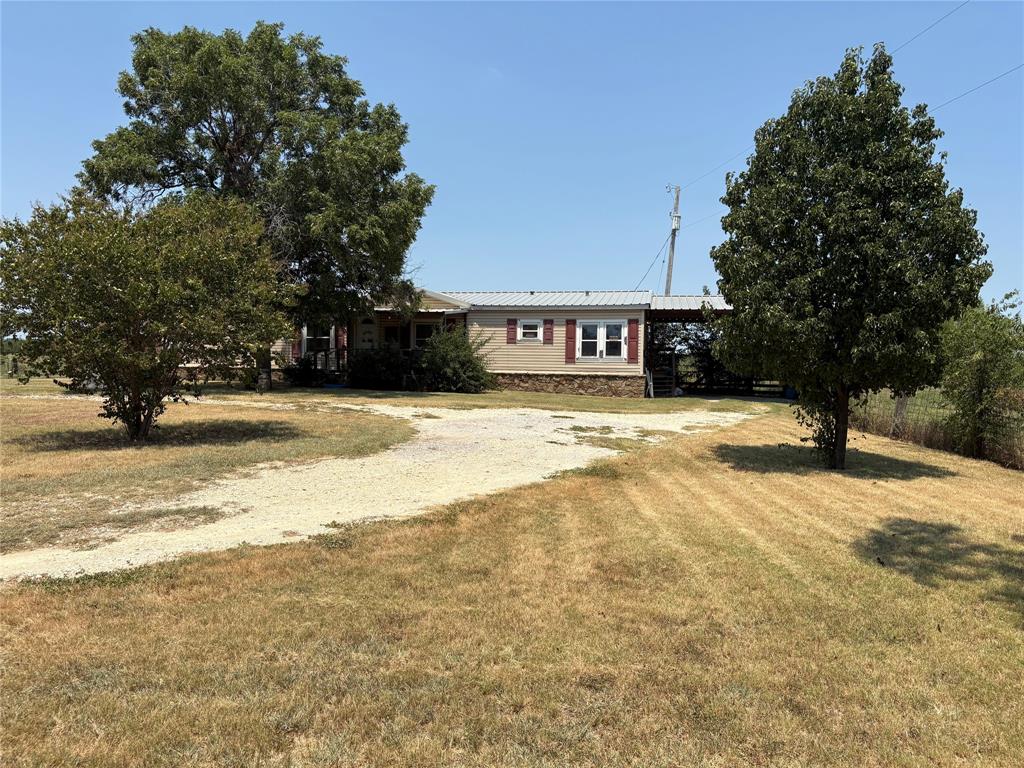 912 Highway 36 W Rising Star Tx 76471 West Rising Star, TX 76471 - Photo 16 of 28 a swimming pool with trees in front of it