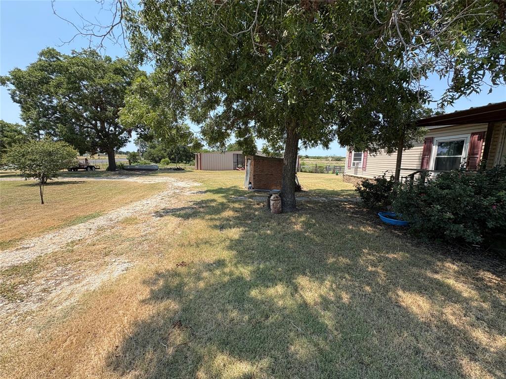 912 Highway 36 W Rising Star Tx 76471 West Rising Star, TX 76471 - Photo 22 of 28 a view of a tree with a yard