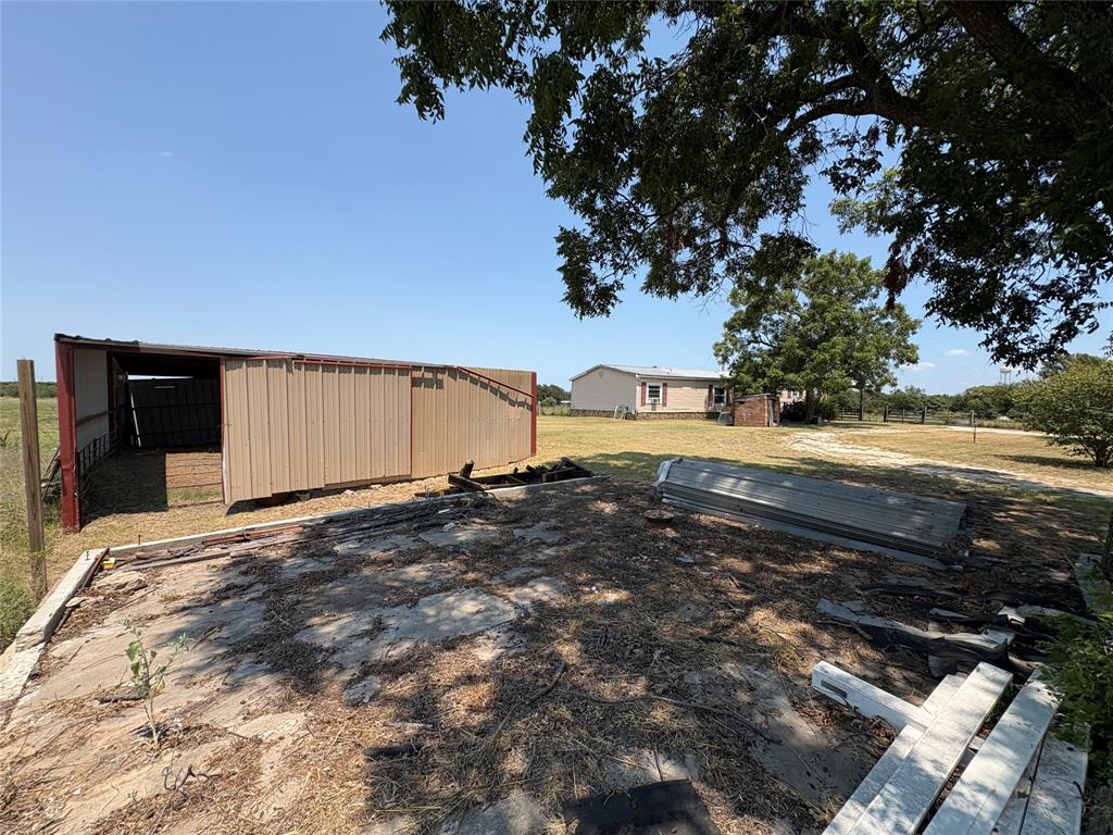 912 Highway 36 W Rising Star Tx 76471 West Rising Star, TX 76471 - Photo 23 of 28 a view of a yard with an outdoor space