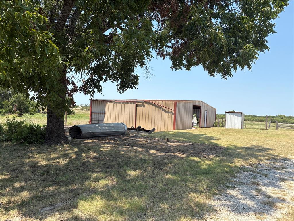 912 Highway 36 W Rising Star Tx 76471 West Rising Star, TX 76471 - Photo 8 of 28 a view of a house with a yard and tree s