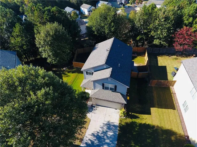 an aerial view of house with yard swimming pool and outdoor seating