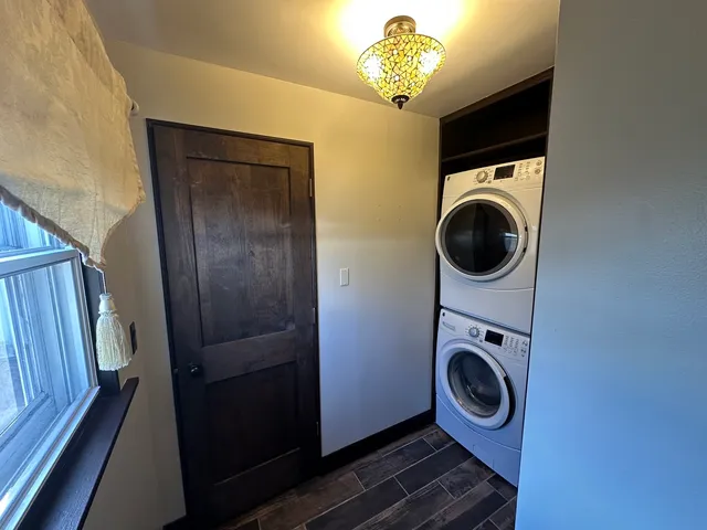 a view of a hallway with washer and dryer