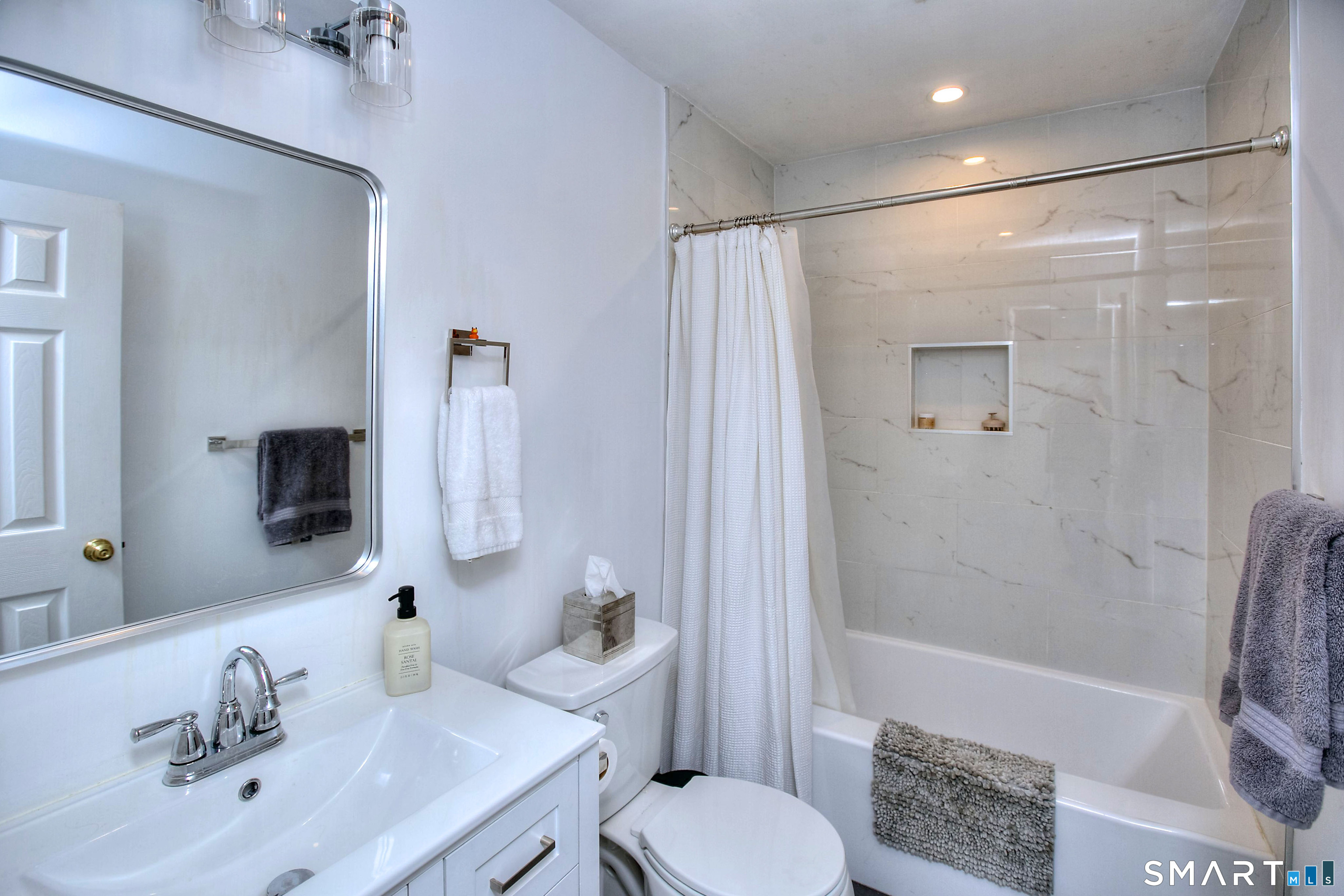 324 Ridge Road Orange, CT 06477 - Photo 30 of 38 a bathroom with a sink toilet and shower