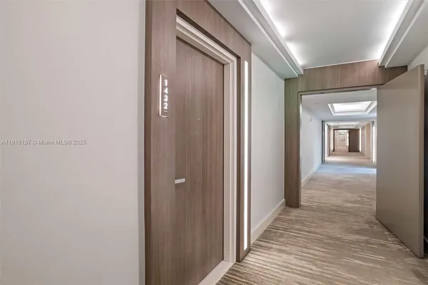 a bedroom with two beds and a desk