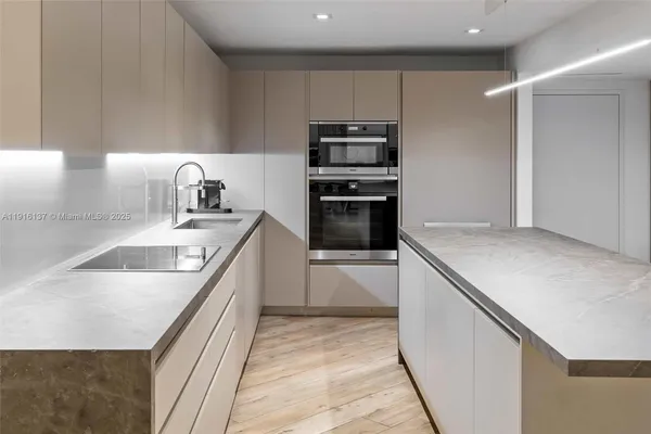 a living room with furniture potted plant a flat screen tv and a fireplace