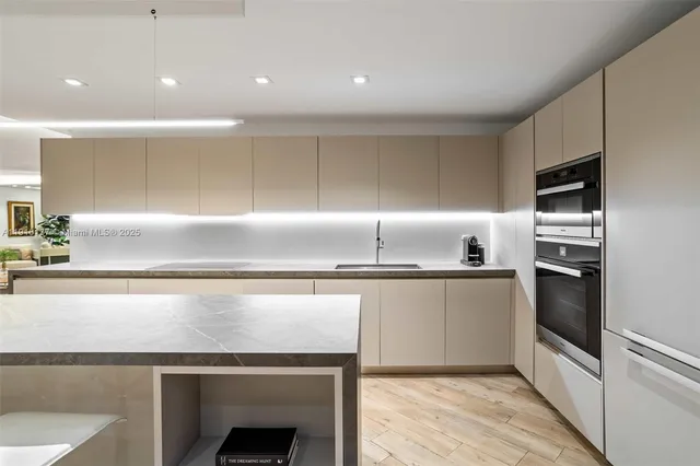 a kitchen with a table and chairs in it