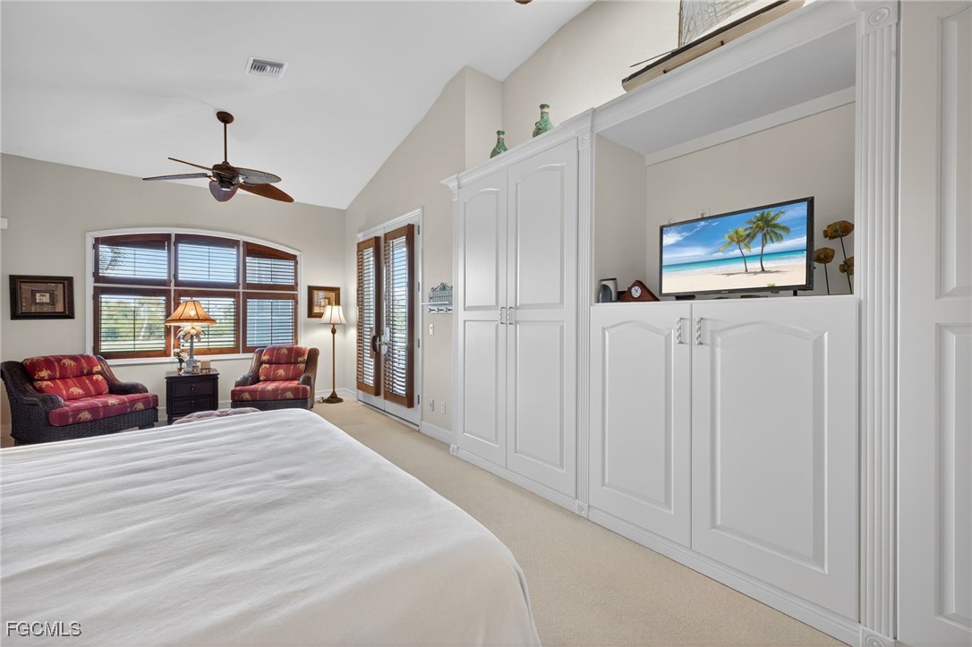 816 Birdie View Point Sanibel, FL 33957 - Photo 16 of 43 a bed room with bed and a large mirror