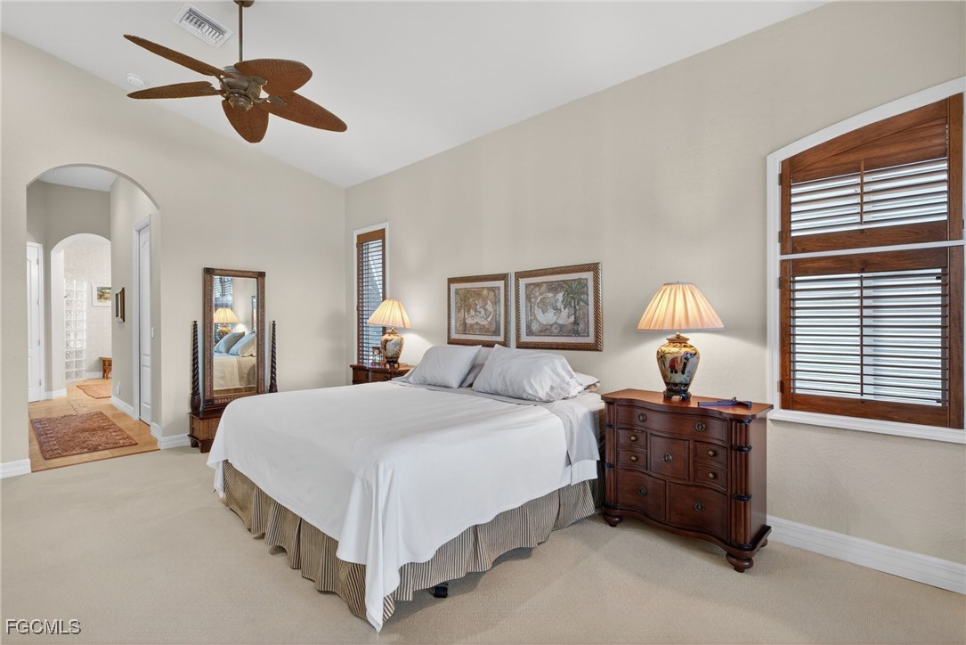 816 Birdie View Point Sanibel, FL 33957 - Photo 17 of 43 a bedroom with a bed chandelier and window