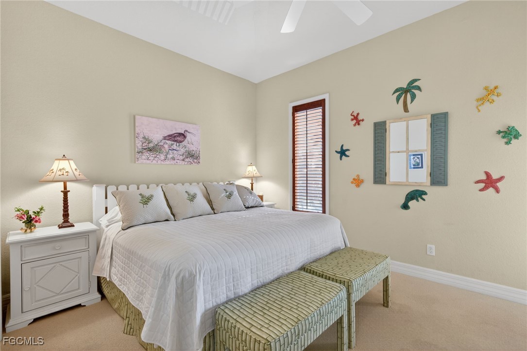 816 Birdie View Point Sanibel, FL 33957 - Photo 20 of 43 a bedroom with a bed and a cabinets