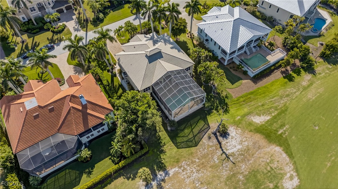 816 Birdie View Point Sanibel, FL 33957 - Photo 39 of 43 an aerial view of a house with a yard