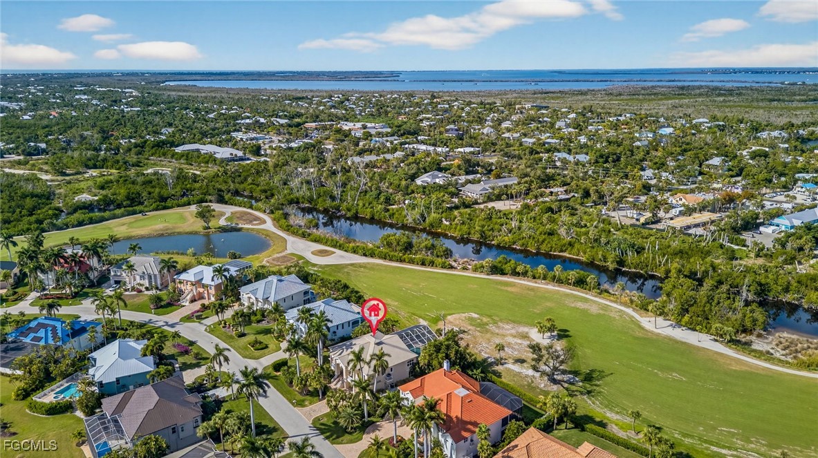 816 Birdie View Point Sanibel, FL 33957 - Photo 42 of 43 an aerial view of a residential houses with outdoor space and swimming pool