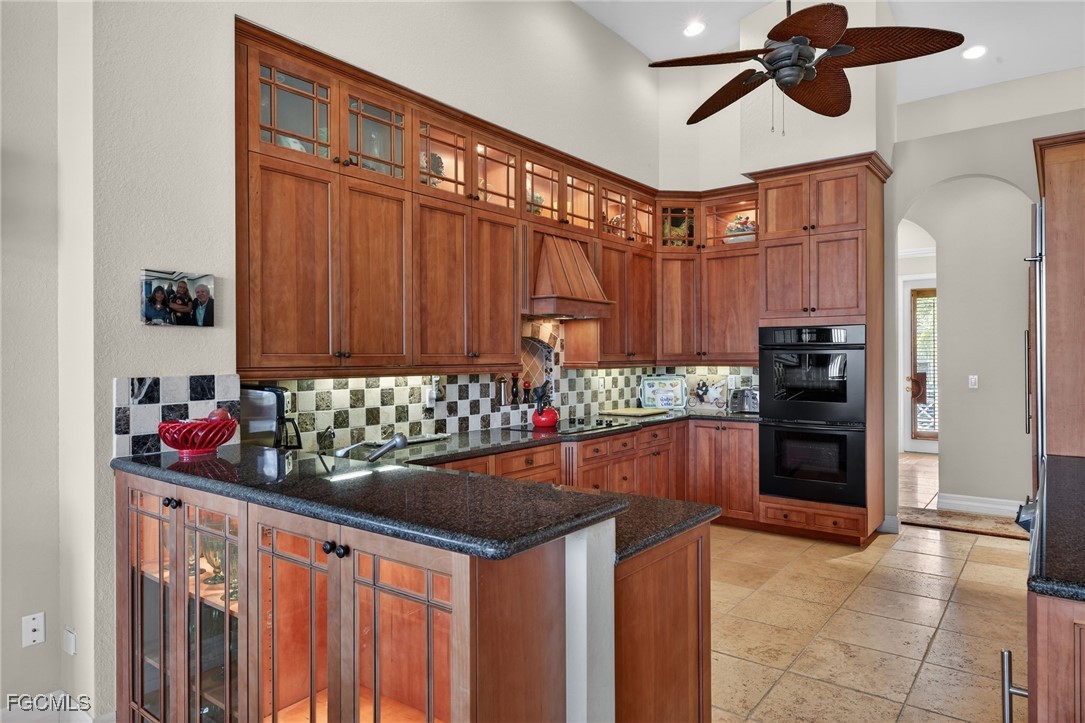 816 Birdie View Point Sanibel, FL 33957 - Photo 10 of 43 a kitchen with stainless steel appliances kitchen island granite countertop a refrigerator and a sink