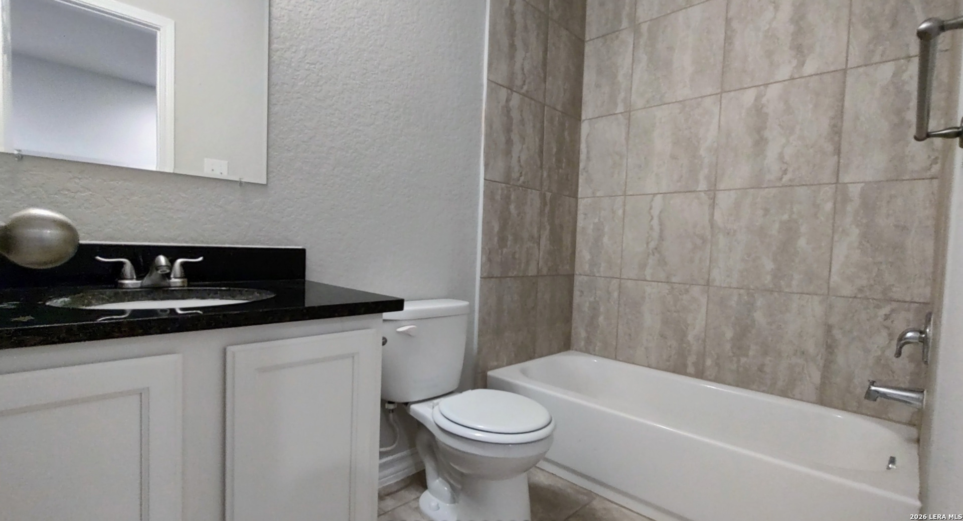 16901 Dancing Ava Selma, TX 78154 - Photo 11 of 14 a bathroom with a sink a toilet and bathtub