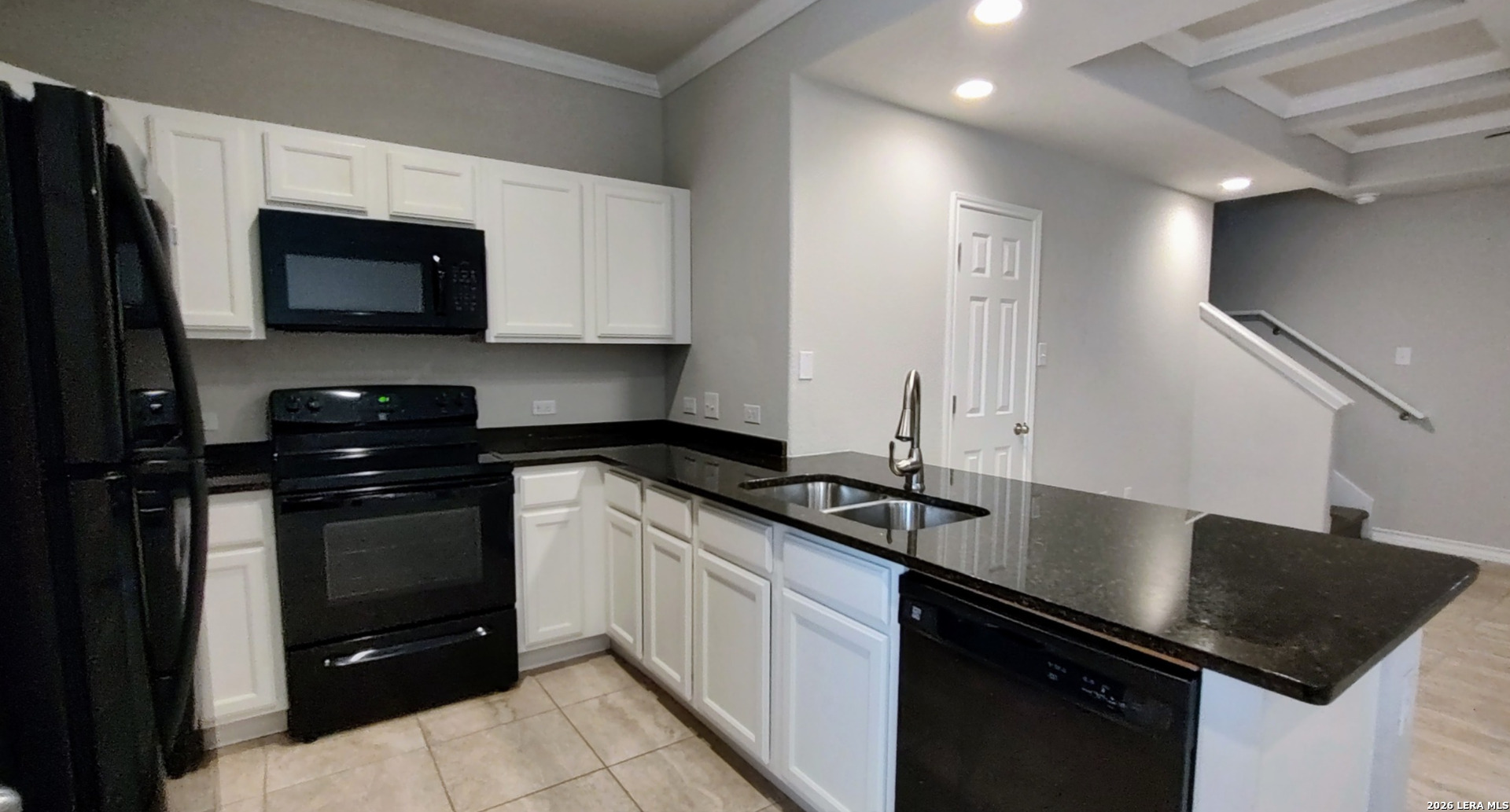16901 Dancing Ava Selma, TX 78154 - Photo 3 of 14 a kitchen with a sink stove and microwave
