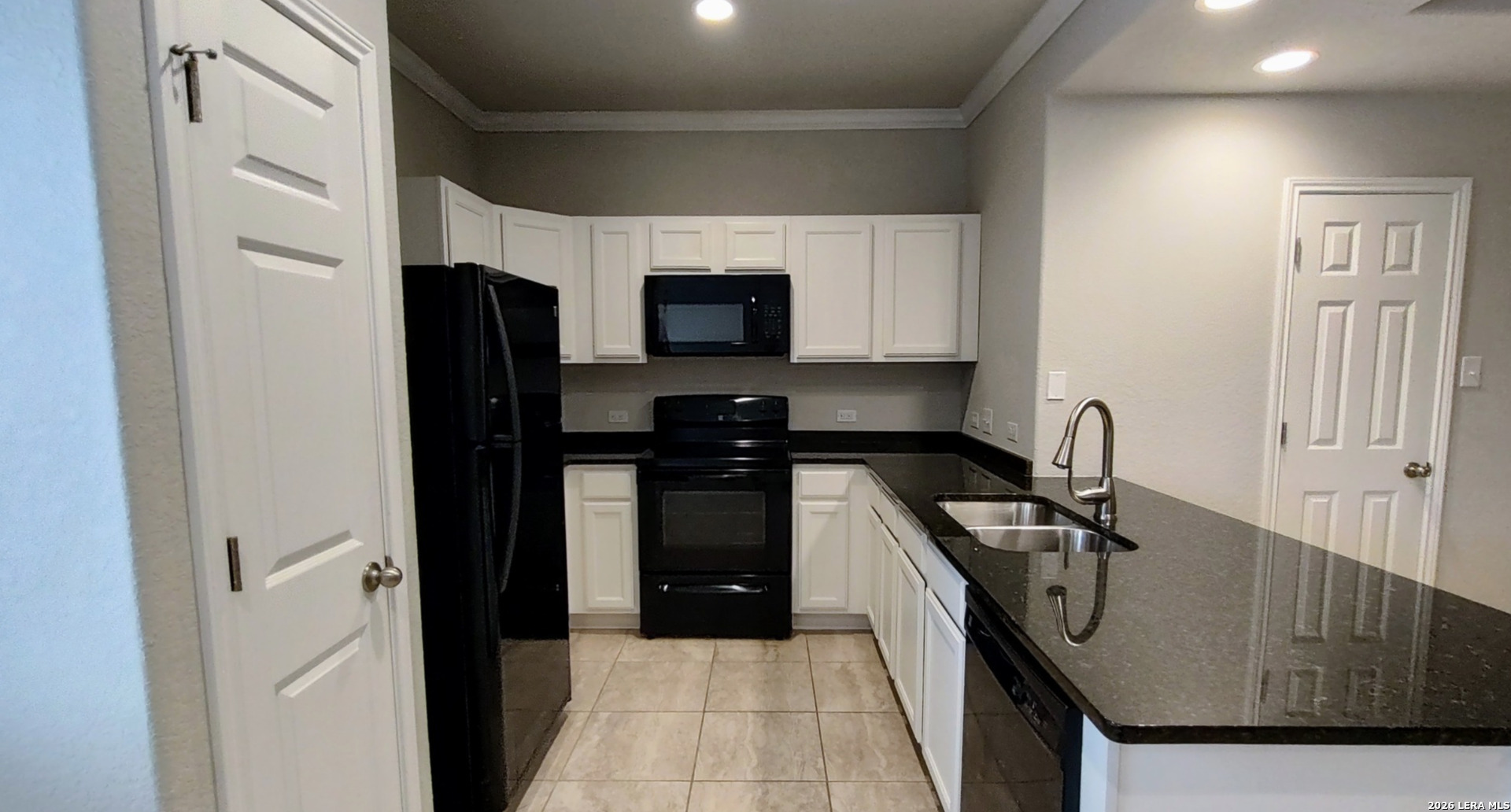 16901 Dancing Ava Selma, TX 78154 - Photo 4 of 14 a kitchen with stainless steel appliances granite countertop a refrigerator a stove and a sink