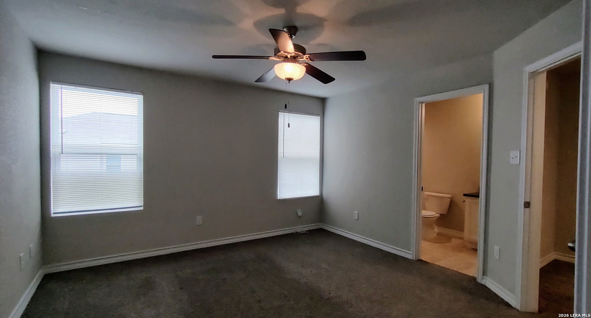 16901 Dancing Ava Selma, TX 78154 - Photo 7 of 14 an empty room with window and a ceiling fan